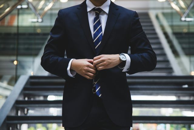 Corporate man in suit to represent company nominee director or shareholder